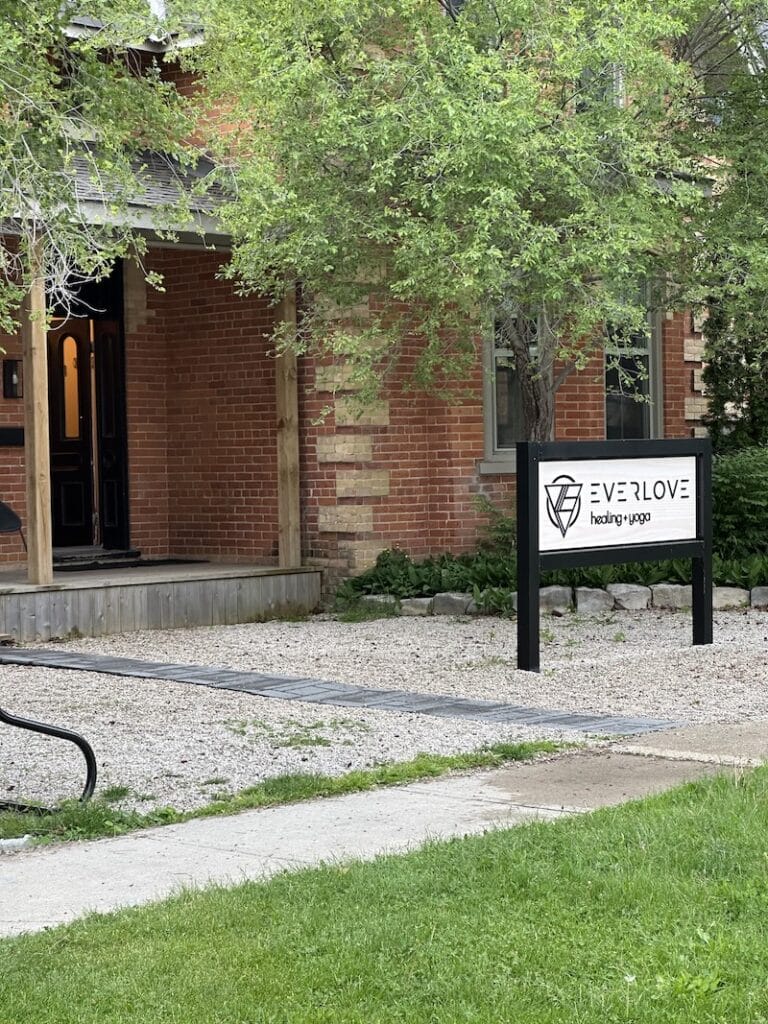 Exterior of Everlove Yoga Collingwood Ontario with brick facade house and entrance on the front street.